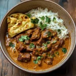 Slow-Cooked Beef and Coconut Curry with Garlic Naan